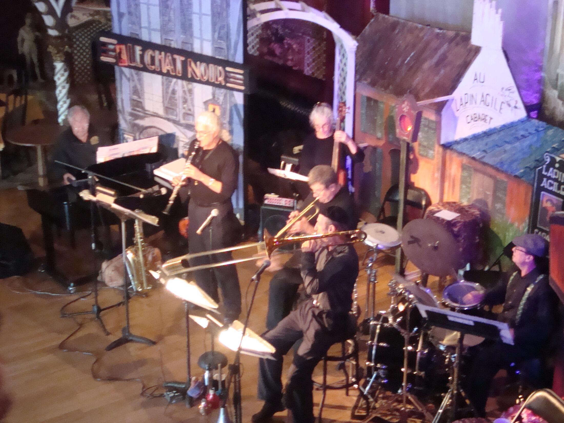 A band performing to a full room at Tango Del Rey.