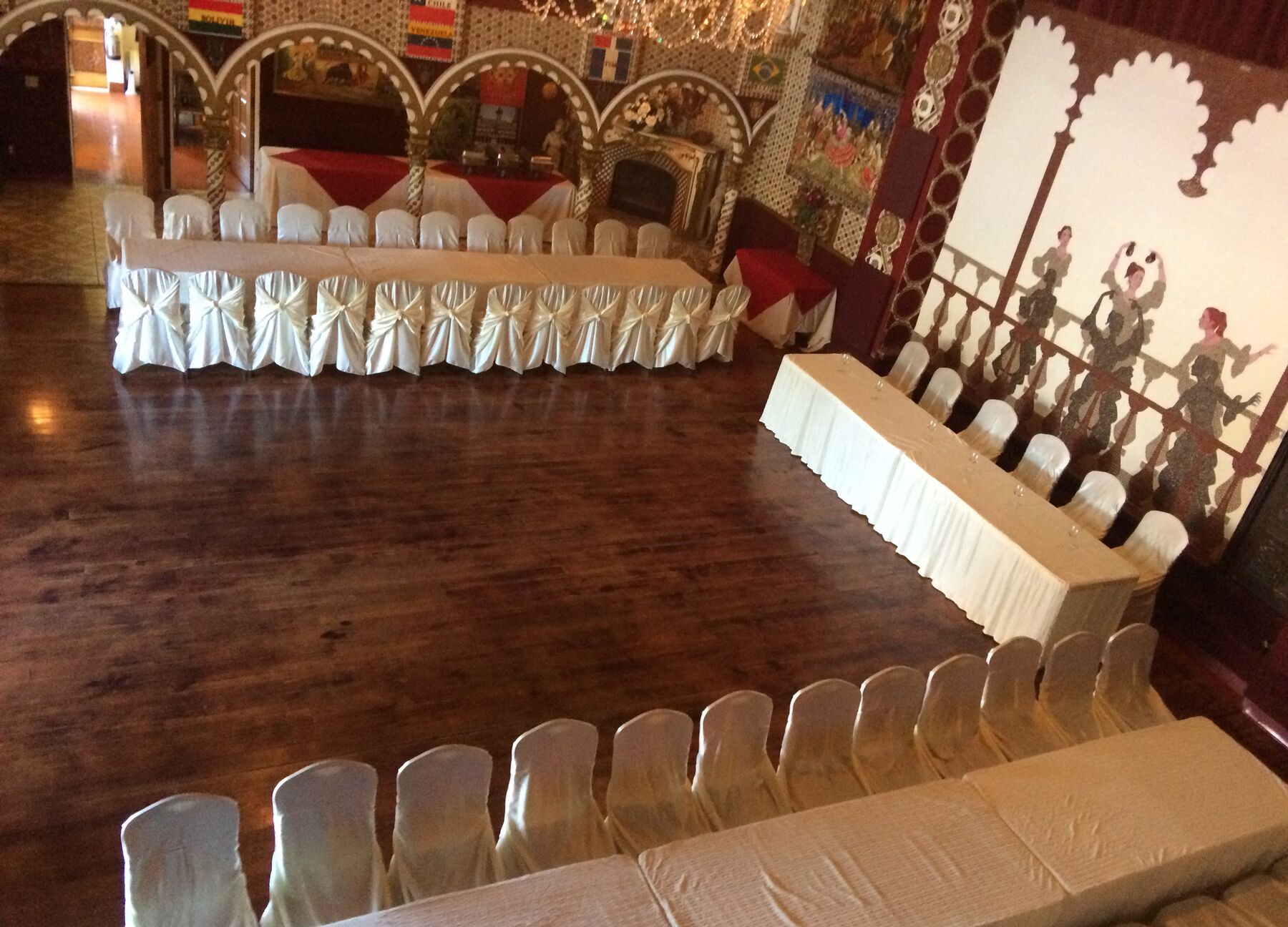 The ballroom set for a banquet in daylight.