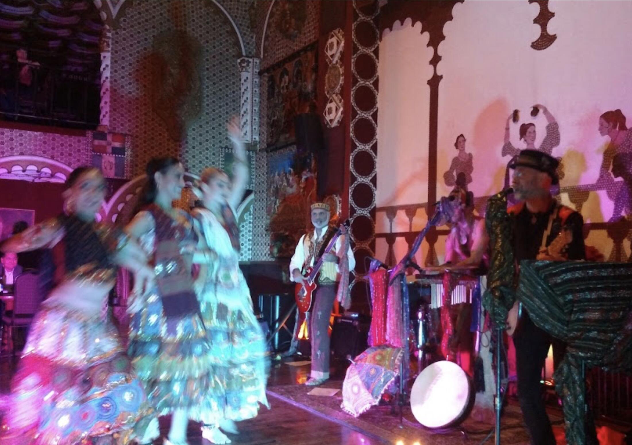 Flamenco dancers performing on stage.